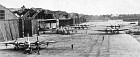 He 177s of II/K.G.40 being prepared for an attack. Five of the bombers carry glider-bombs, one under each outer wing. The airfield at Bordeaux/Merignac was frequently the subject of Allied air attack - note the bomb damage to the hangars